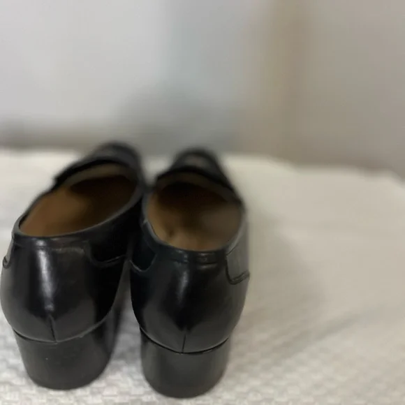 Salvatore Ferragamo Black Loafer Flats with silver logo hardware. Corpcore
